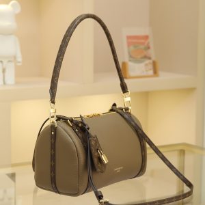 Alternative view of 17 x 13.5 x 26 cm (H x W x L) Cowhide-coated canvas trim Cotton lining Metal hardware Dual zipper closure Removable key pouch and detachable padlock (attaches to zipper pull) Shoulder strap:Removable, adjustable Strap half-length: 41.0 cm Adjustable to: 47.0 cm Handles: Dual handles